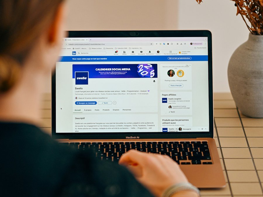 A marketer reviewing a digital campaign on a laptop